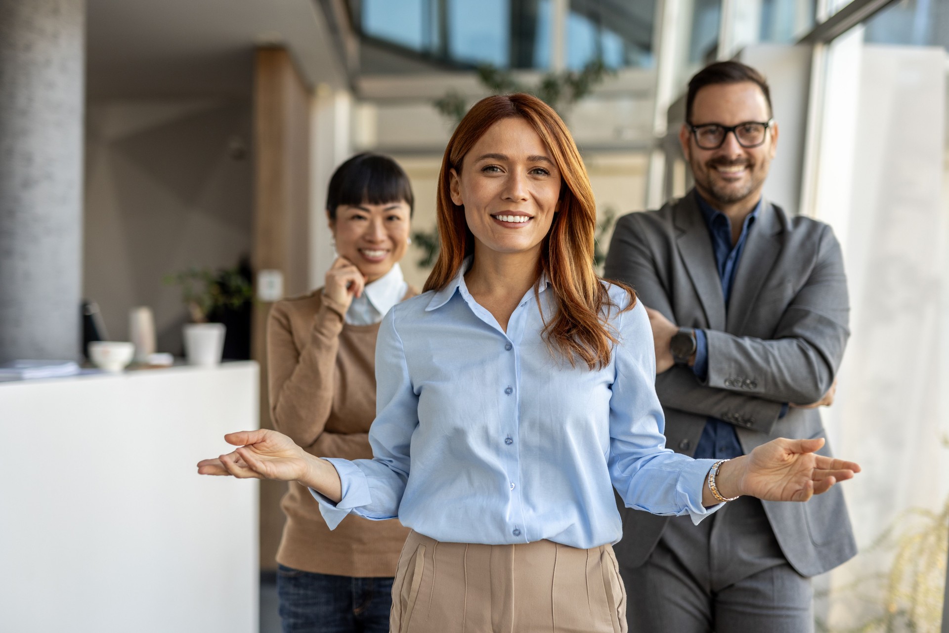 Businesswoman leading presentation to colleagues in modern office